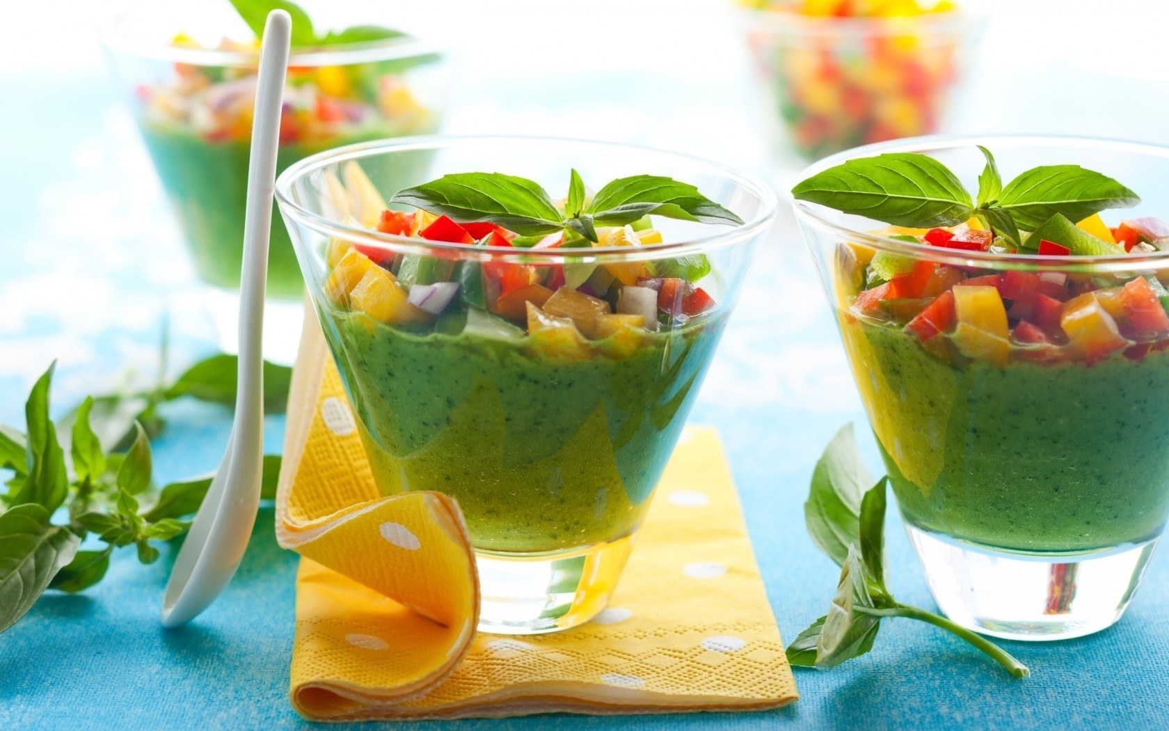 Green soup with vegetable topping