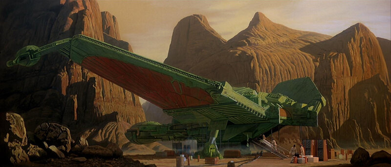 Green spaceship in desert canyon