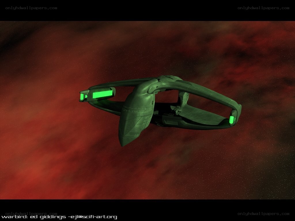 Green spaceship in nebula