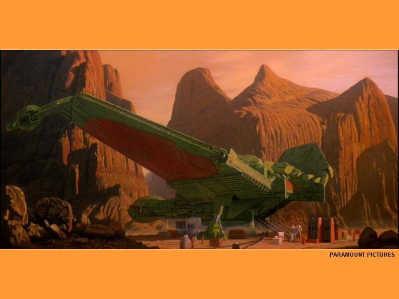 Green Spaceship on Desert