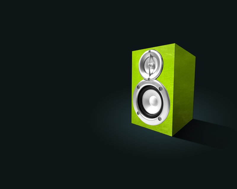 green speaker on dark background