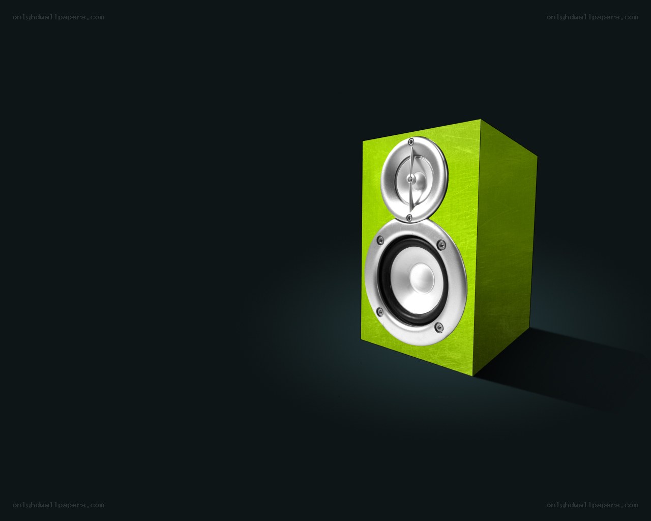 green speaker on dark background