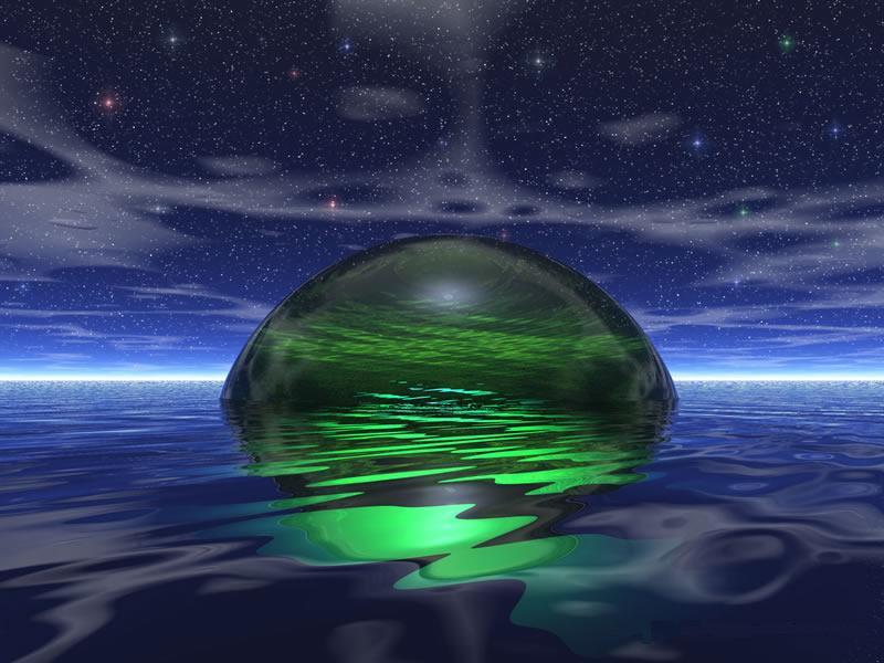 green sphere in ocean at night
