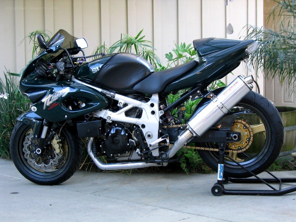 green sport motorcycle on stand