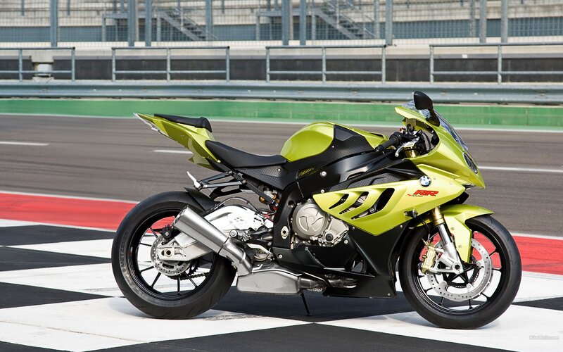 green sport motorcycle on track
