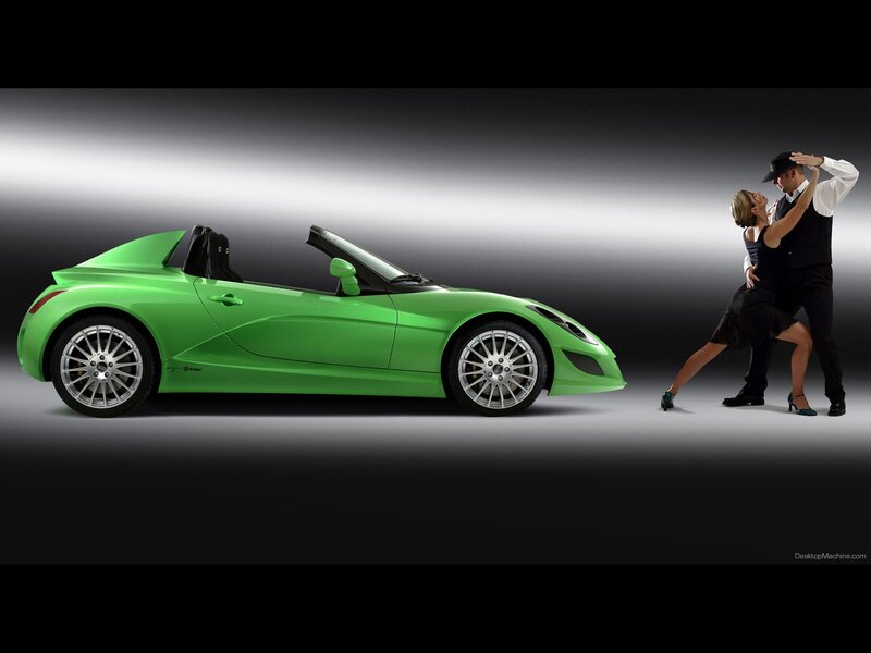 Green sports car and dancers