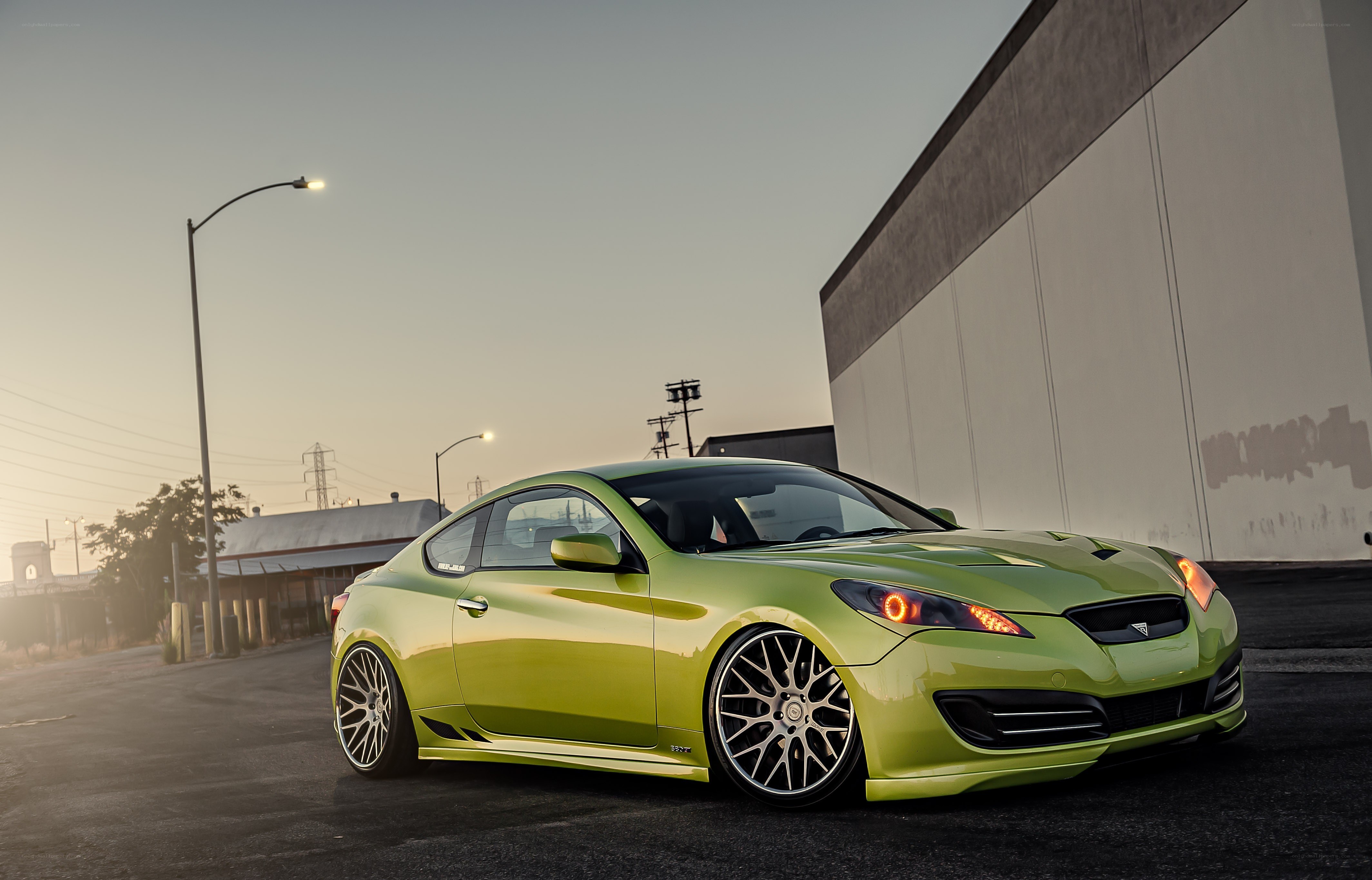 green sports car at dusk