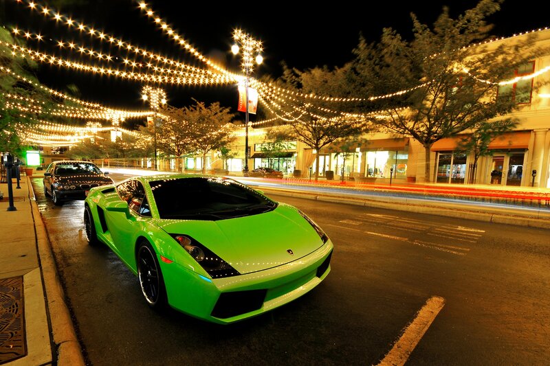 Green sports car at night