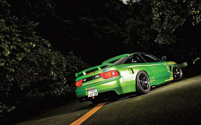 green sports car at night