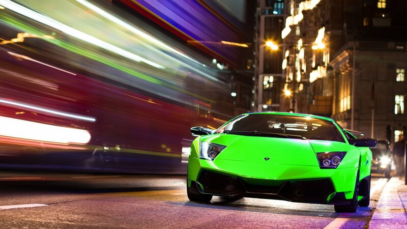 Green sports car at night