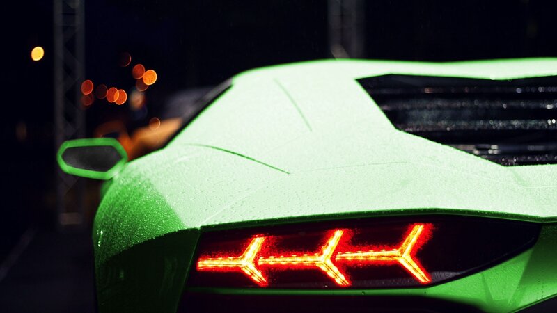 green sports car at night