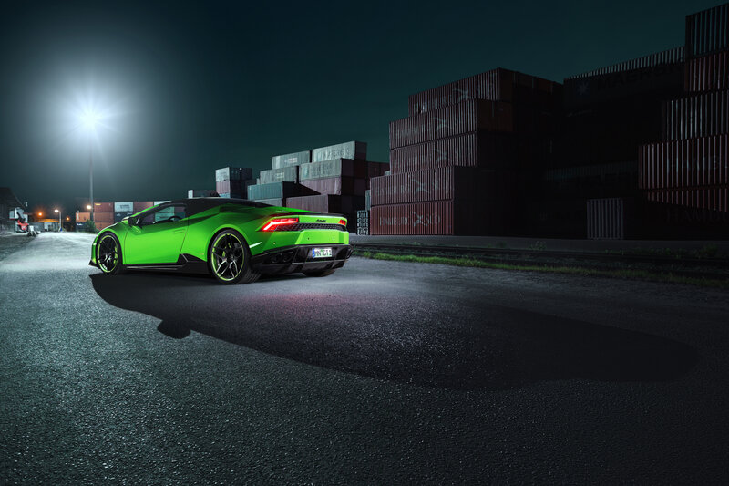 Green sports car at night