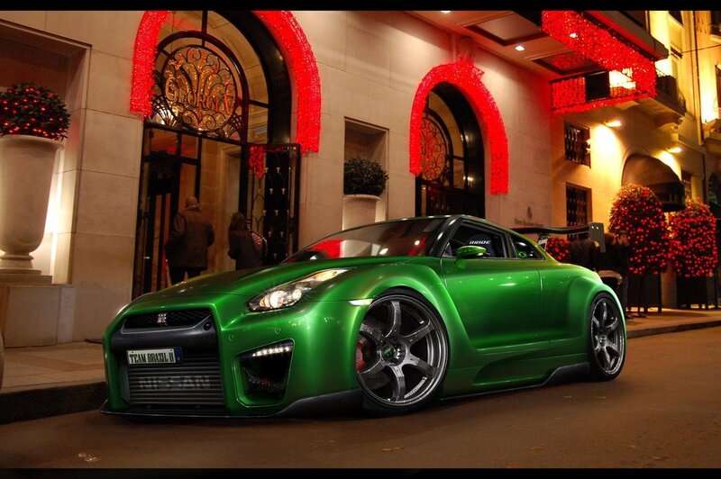 Green sports car at night