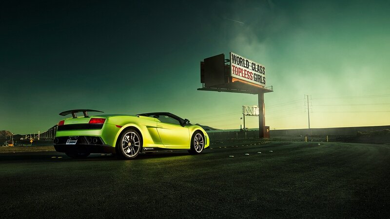 Green sports car at night