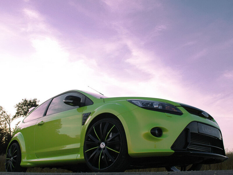 green sports car at sunset