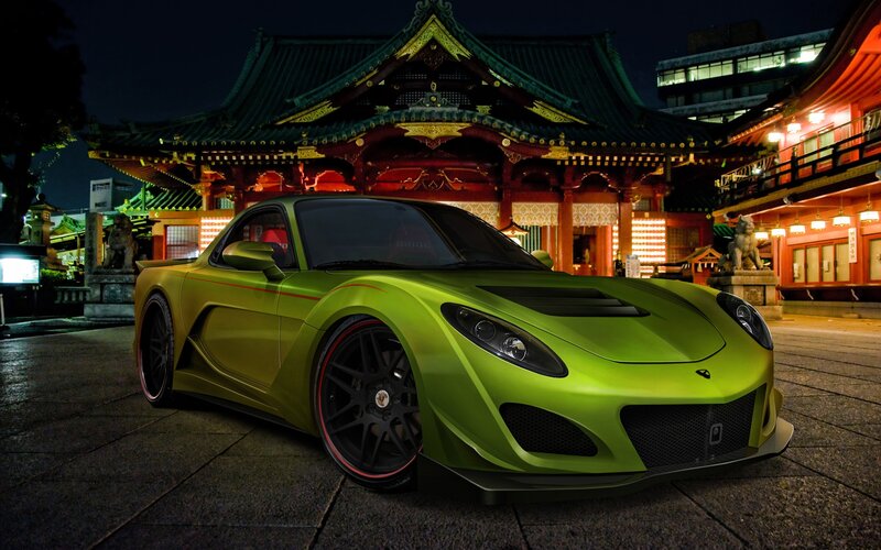 Green sports car at temple