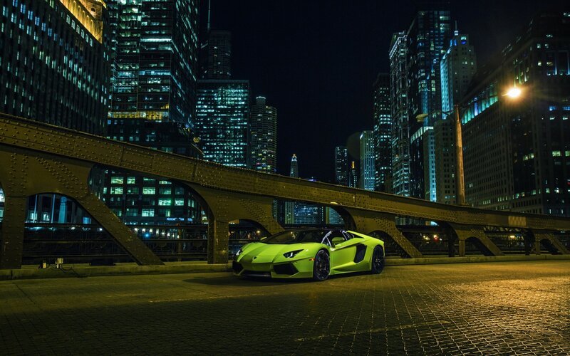 Green Sports Car — Dramatic, Night, Photograph, Bridge, Skyscrapers