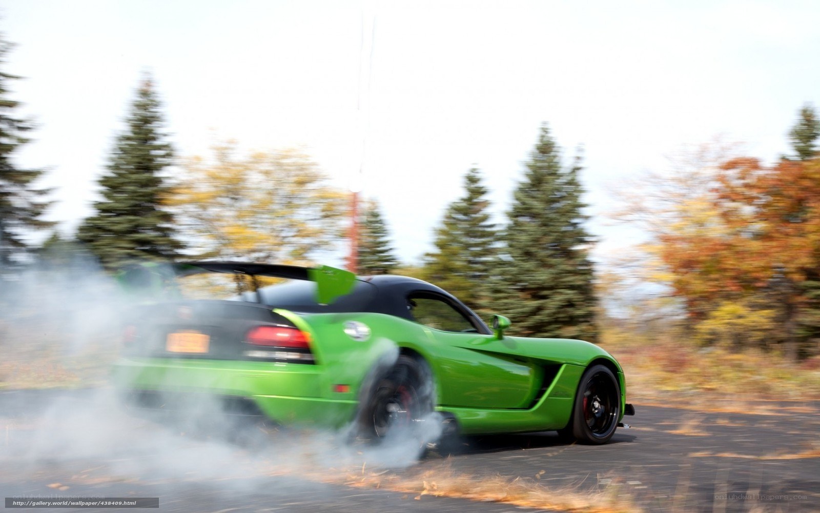 green sports car drifting