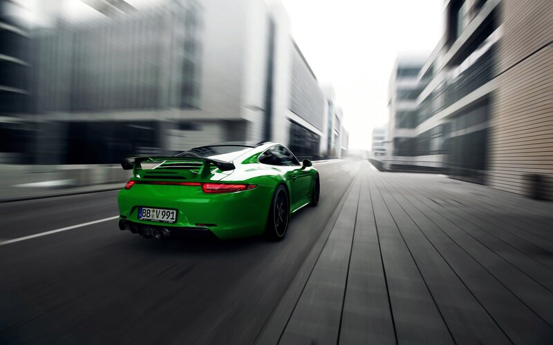 Green Sports Car — Dynamic, Photograph, Road, Buildings