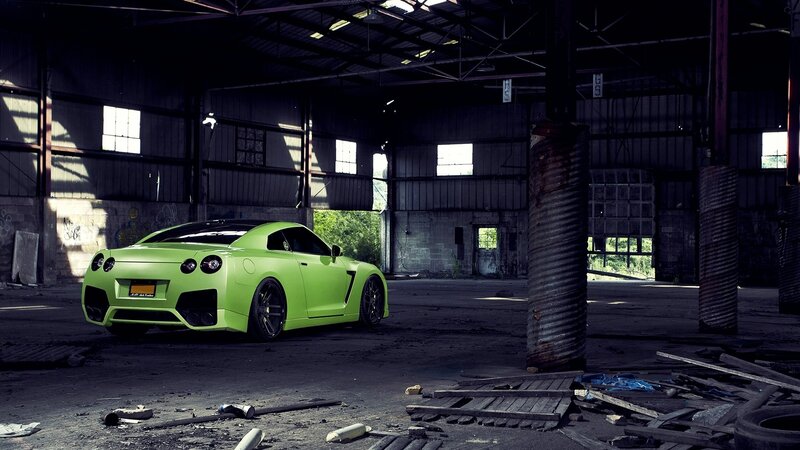 Green sports car in abandoned warehouse