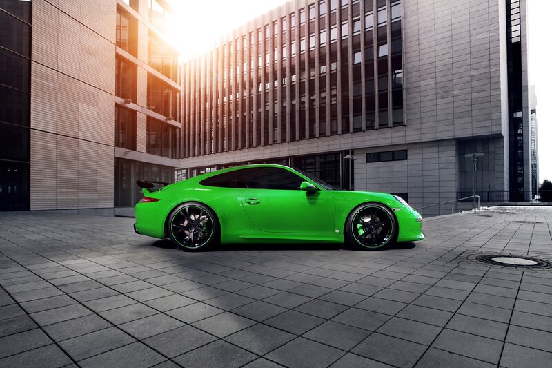 Green sports car in city
