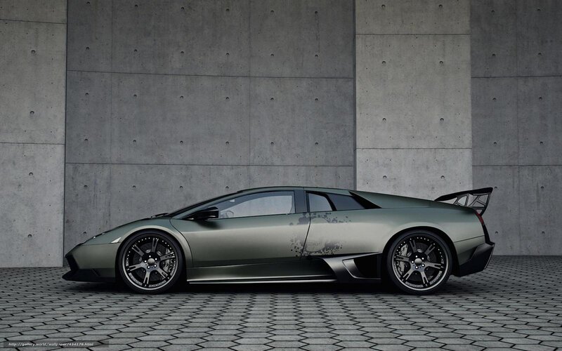 green sports car in concrete setting