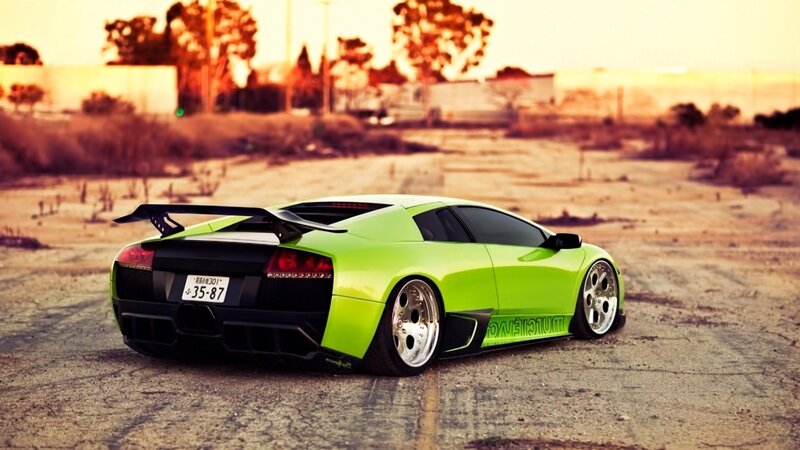 green sports car in desert
