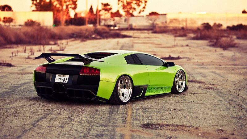 green sports car in empty lot