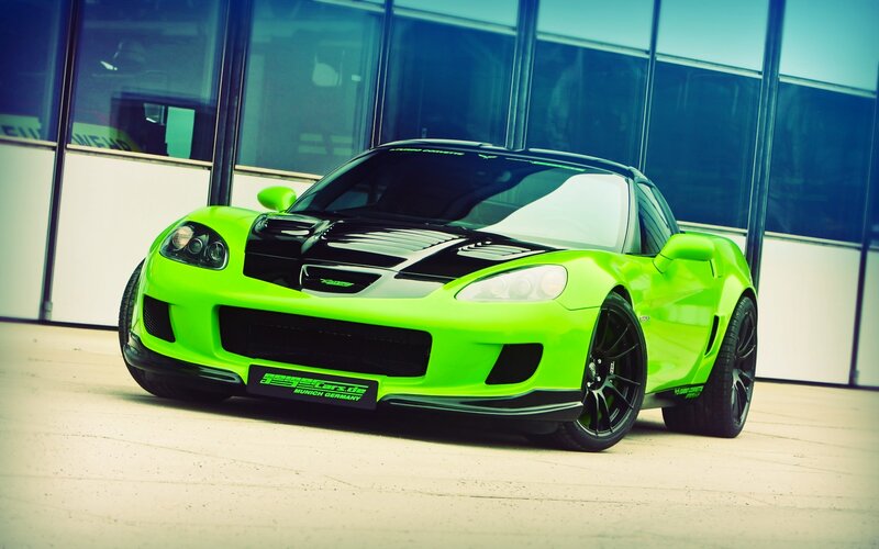 green sports car in front of building