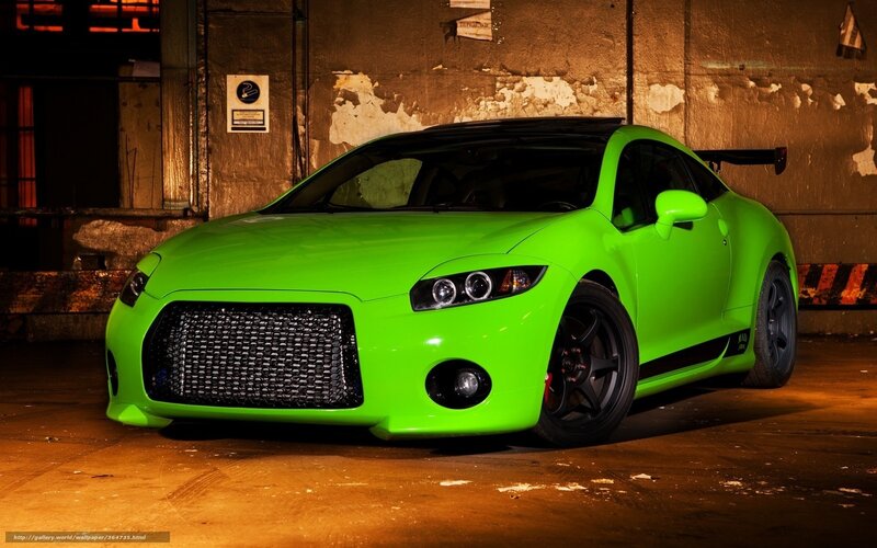 green sports car in garage