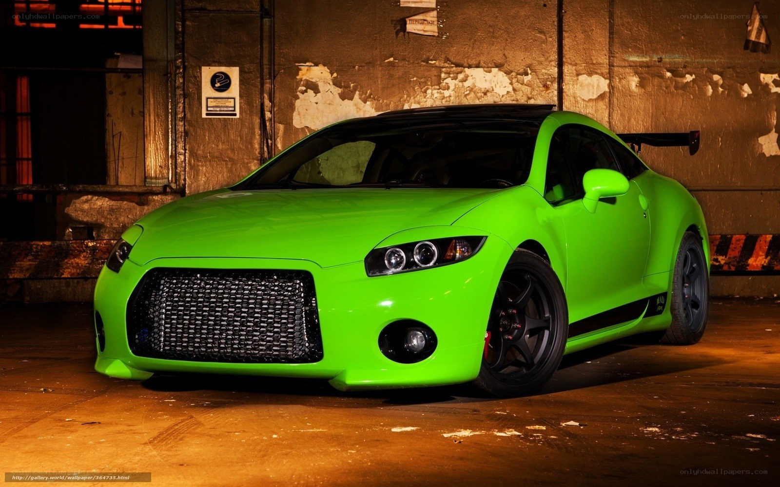 green sports car in garage