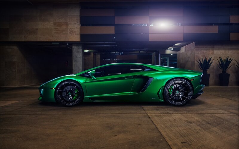 green sports car in garage