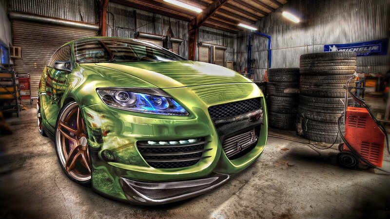 green sports car in garage