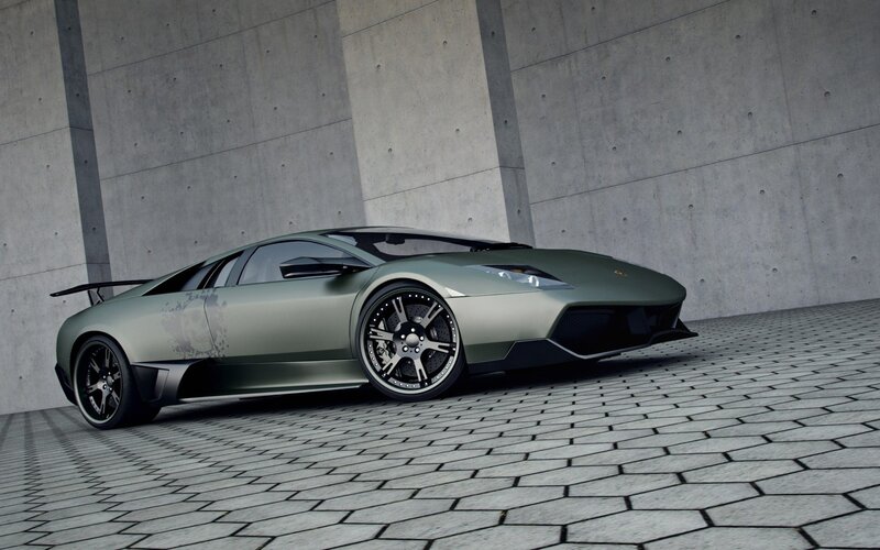green sports car in garage