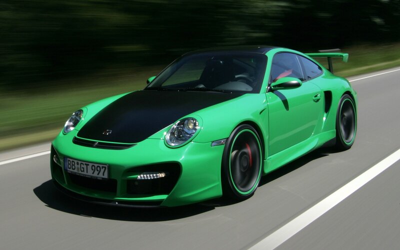 green sports car in motion