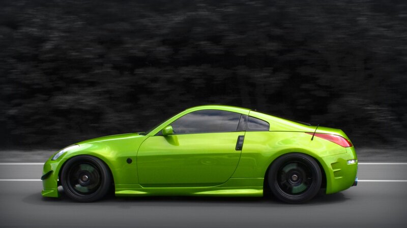 green sports car in motion