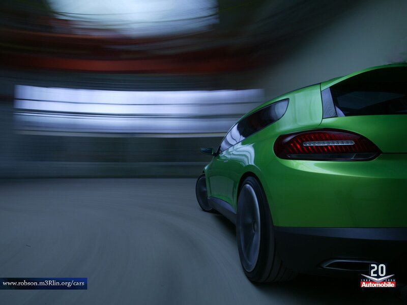Green sports car in motion