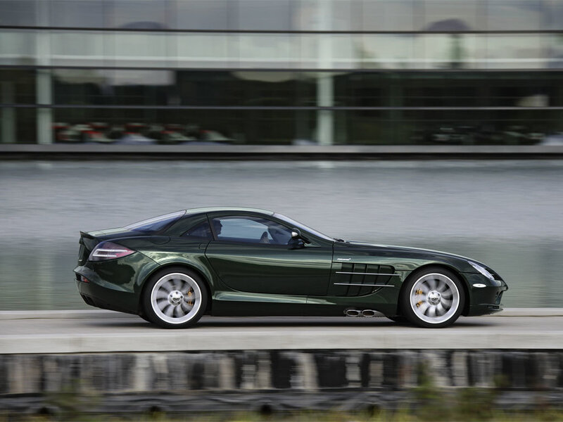 Green sports car in motion