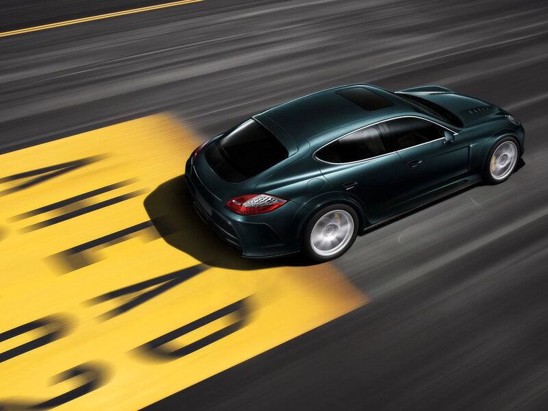 green sports car in motion
