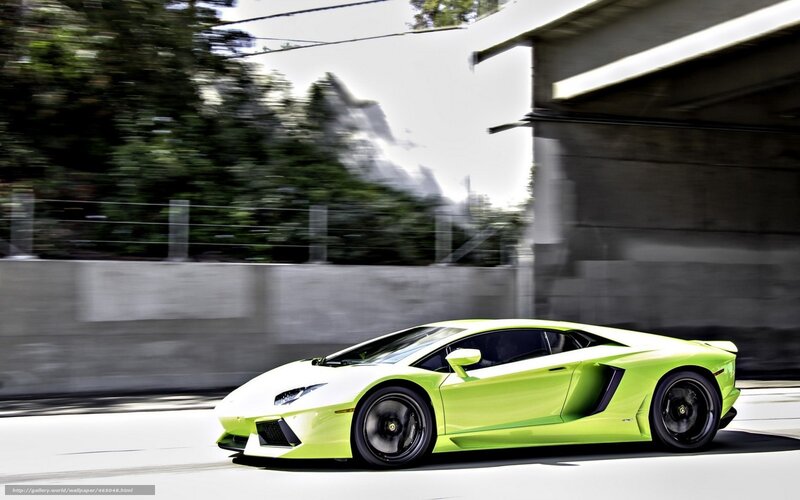green sports car in motion