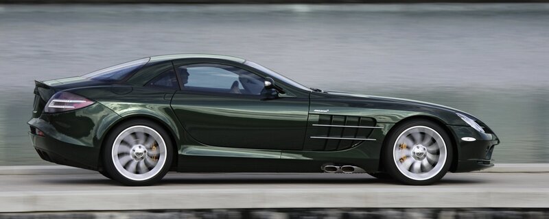 Green sports car in motion