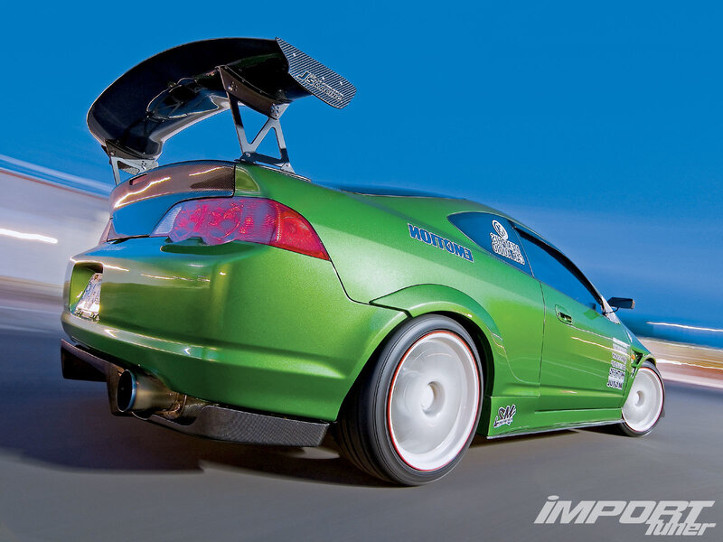 green sports car in motion