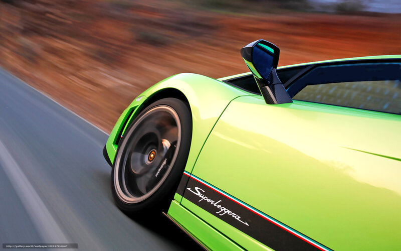 green sports car in motion
