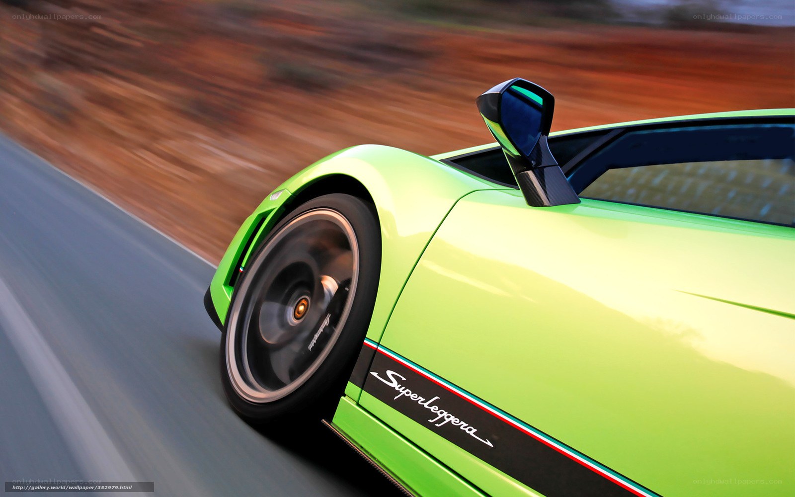 green sports car in motion