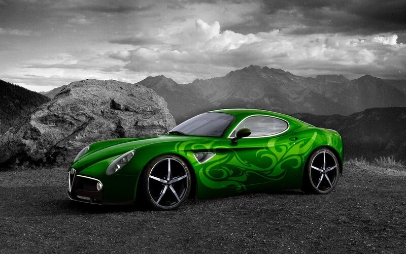 green sports car in mountains