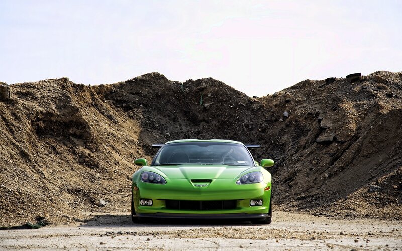 Green sports car in quarry