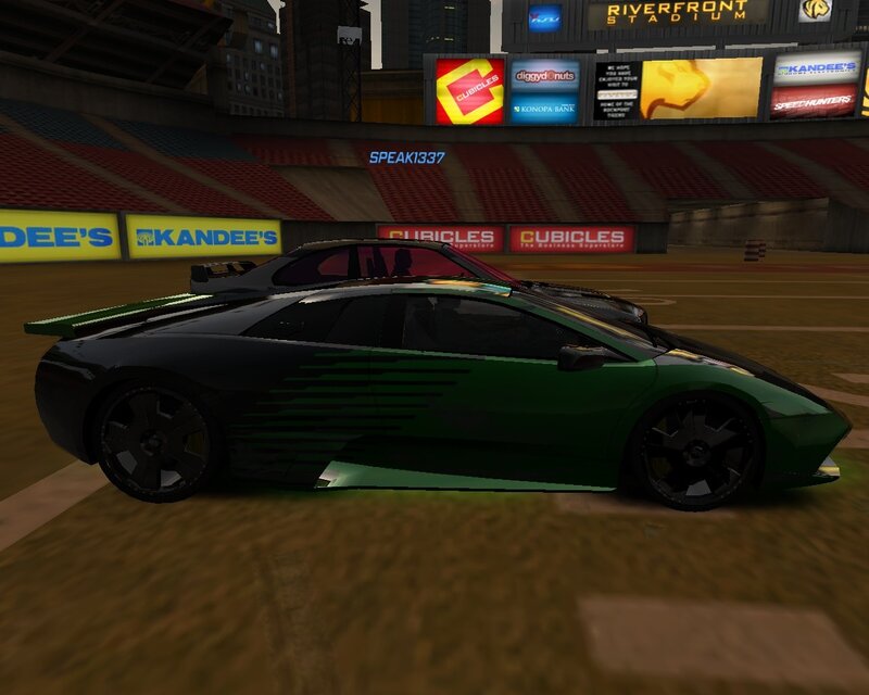 Green sports car in stadium