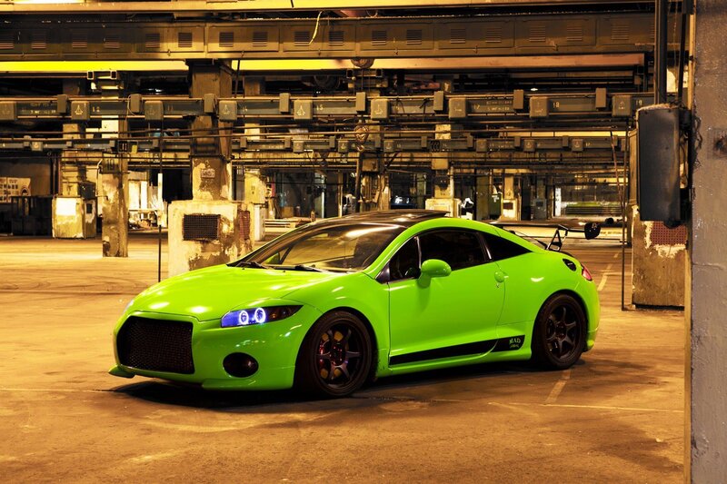 green sports car in warehouse