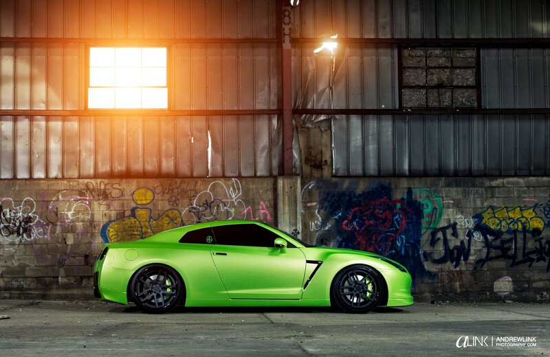 Green sports car in warehouse