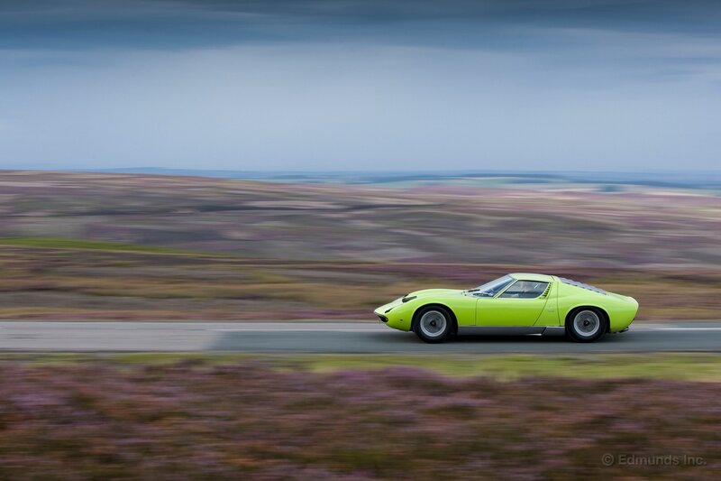 Green sports car on a road